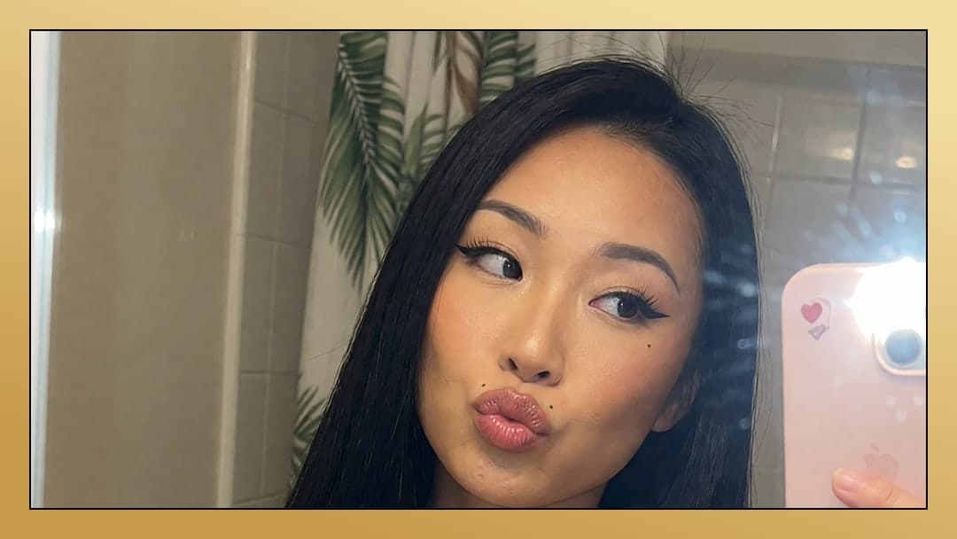 Asian selfie puckered lips bathroom mirror