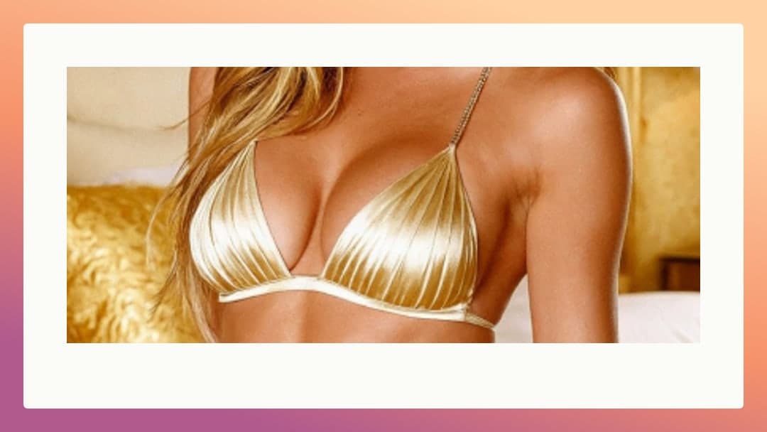 Shiny gold bikini cleavage bedroom