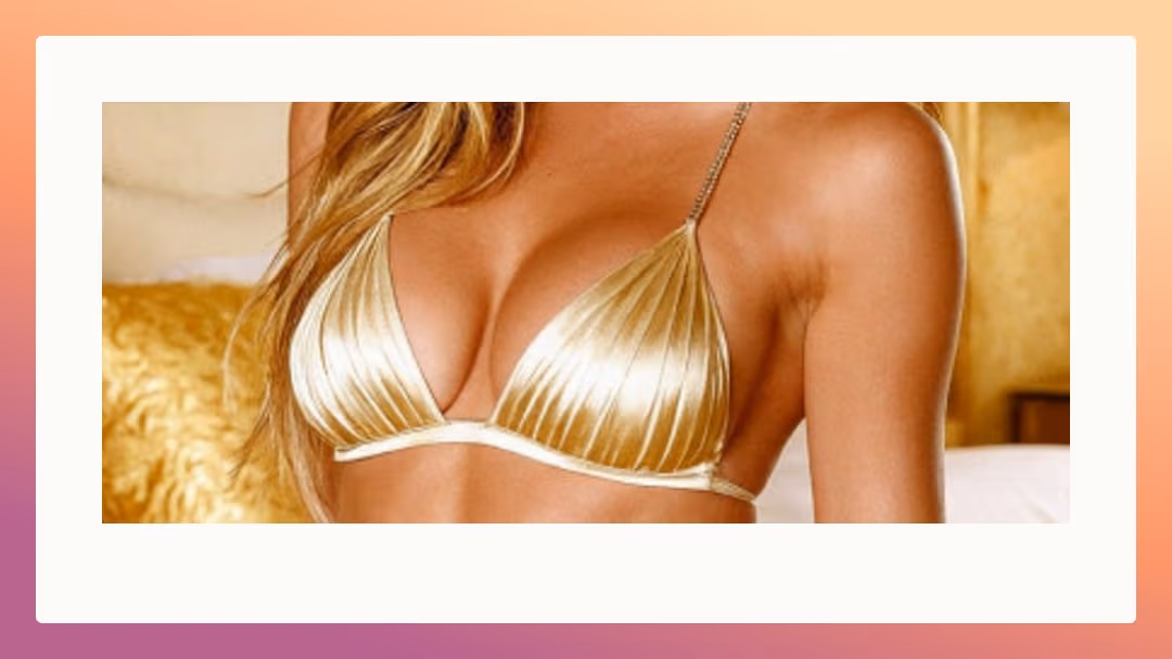 Shiny gold bikini cleavage bedroom