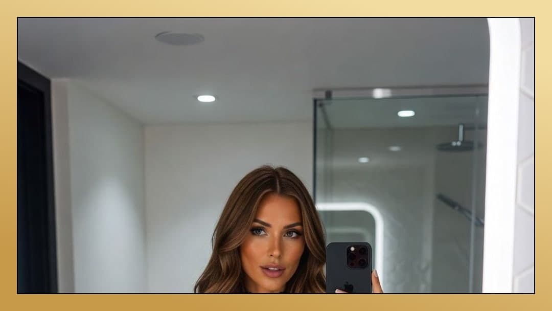 Hazel eyed brunette bathroom mirror selfie