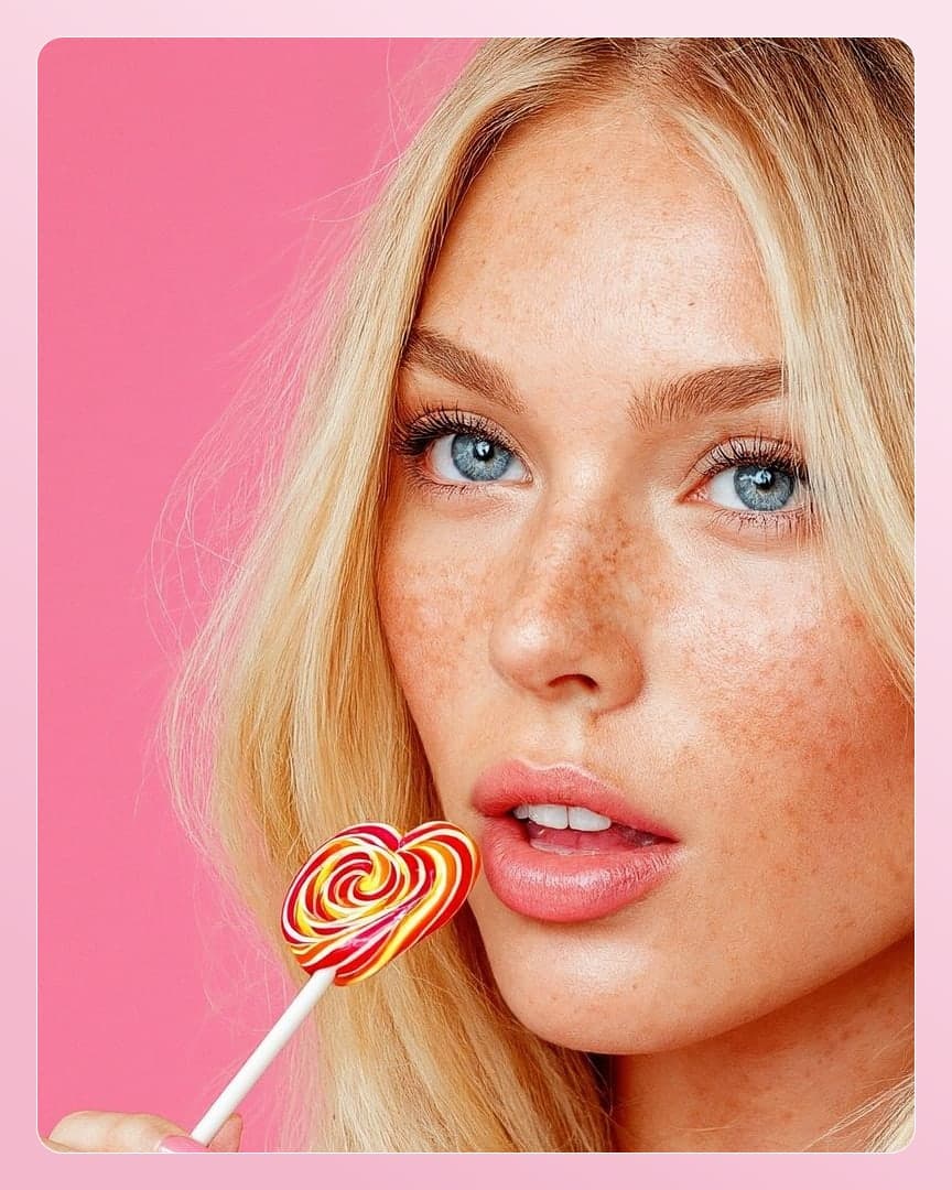Lollipop on glossy lips closeup