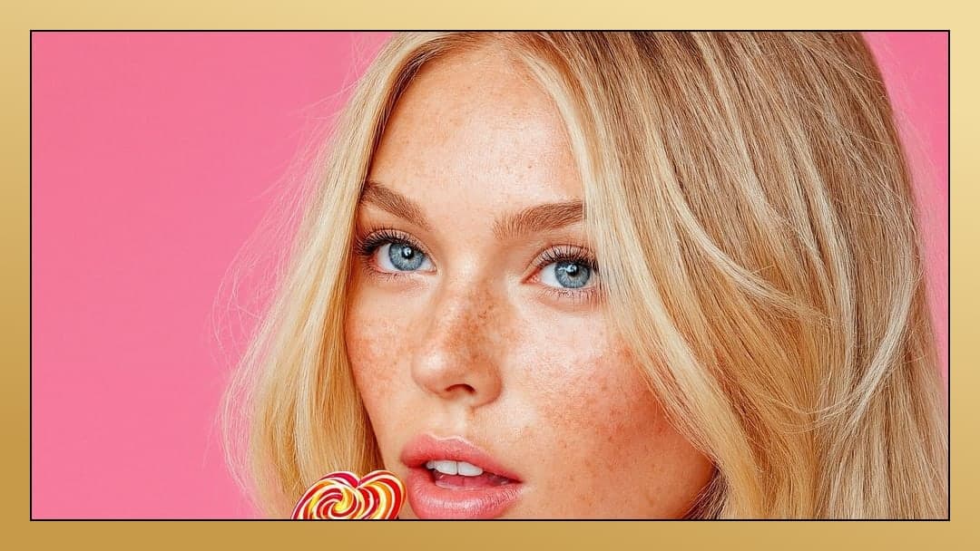 Curvy blonde licks lollipop closeup