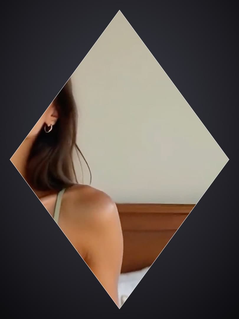 Brunette over-the-shoulder bedroom view