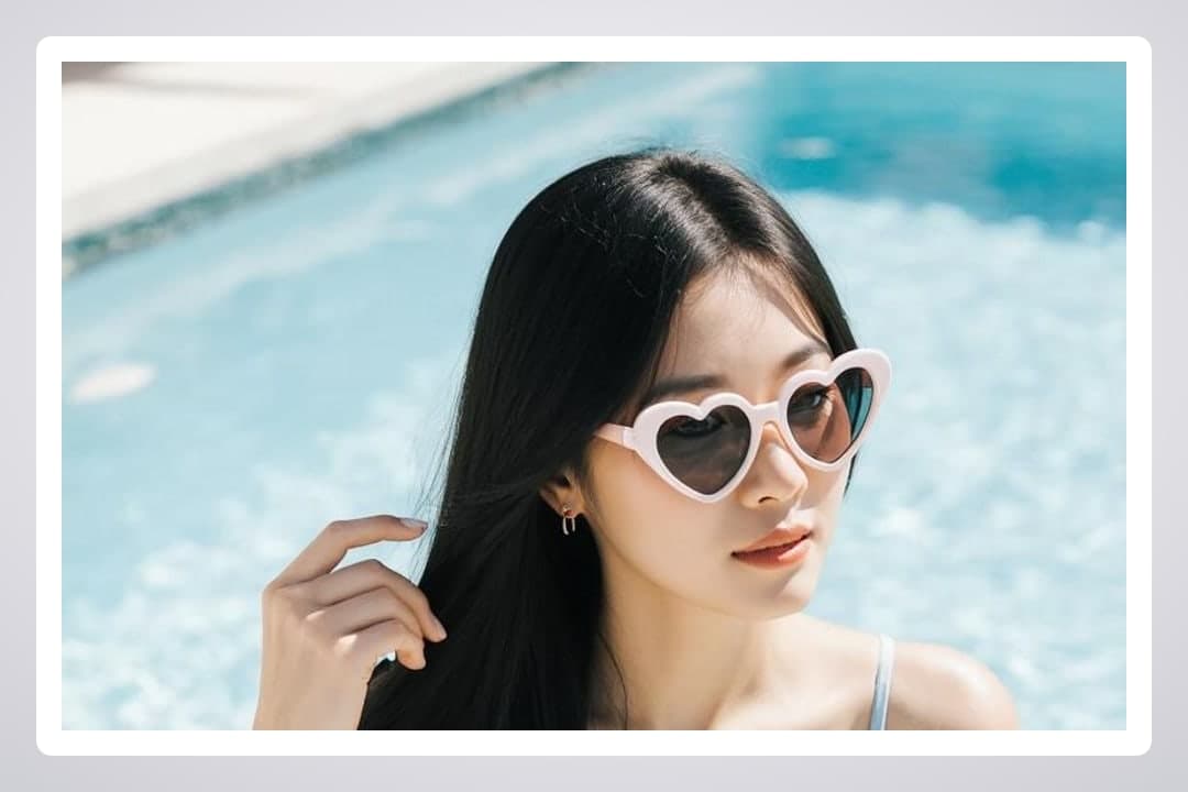 Curvy Asian bikini cleavage poolside