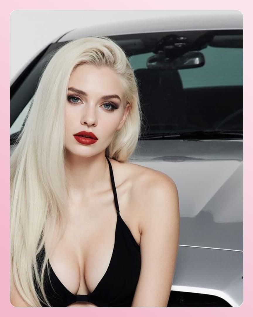Platinum blonde cleavage by silver car