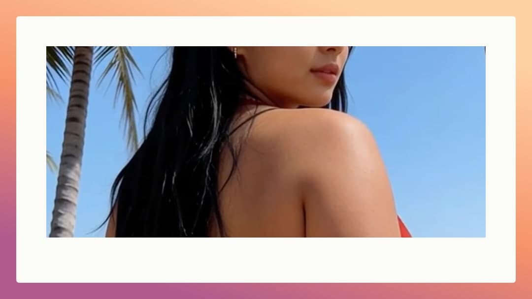 Red bikini back view on sunny beach