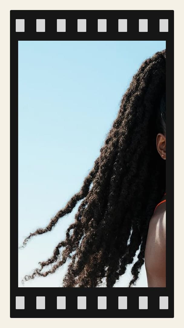 Raven dreadlocks in bright sun