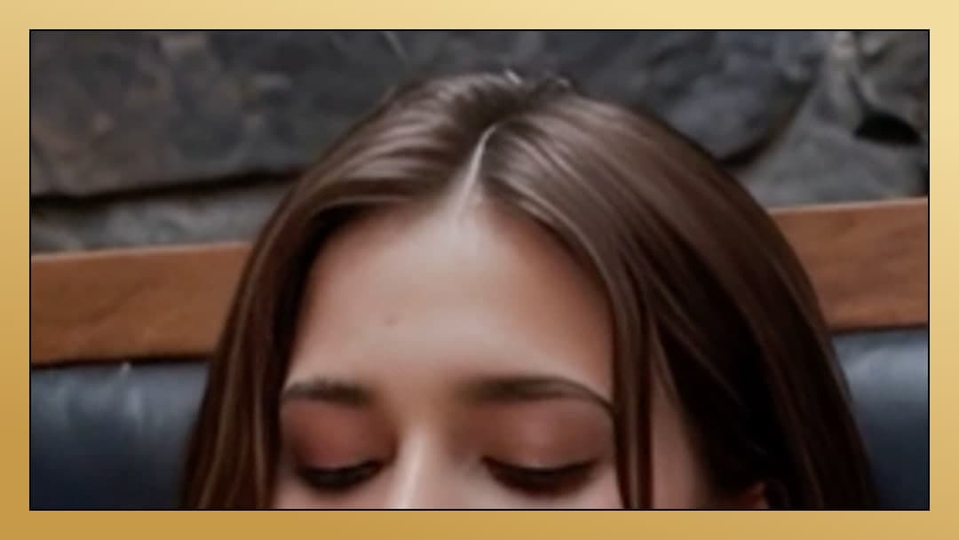 Brunette eyes closed on wooden bench
