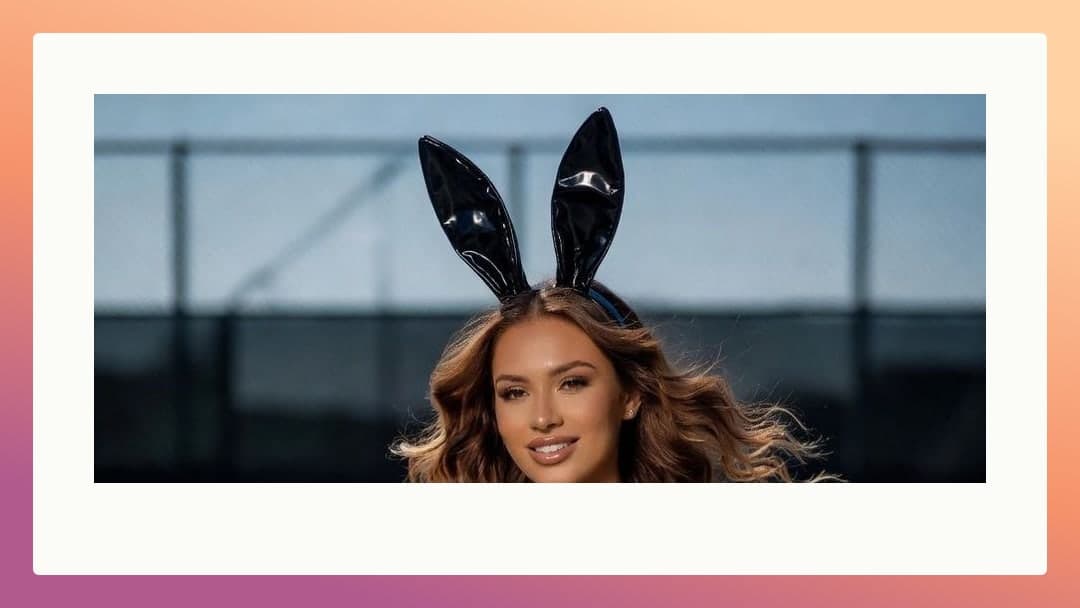 Bunny ears selfie by chain link fence