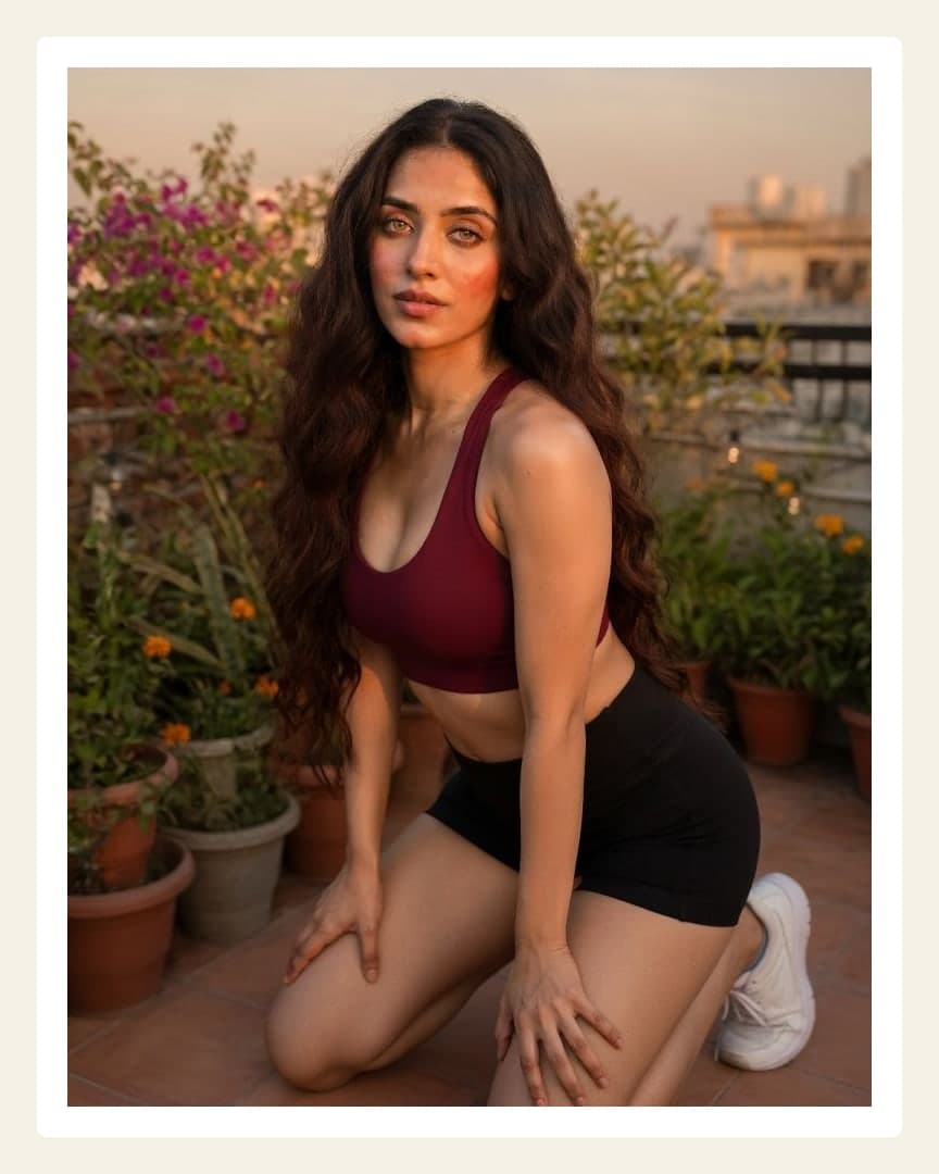 Curvy Latina rooftop sunset pose