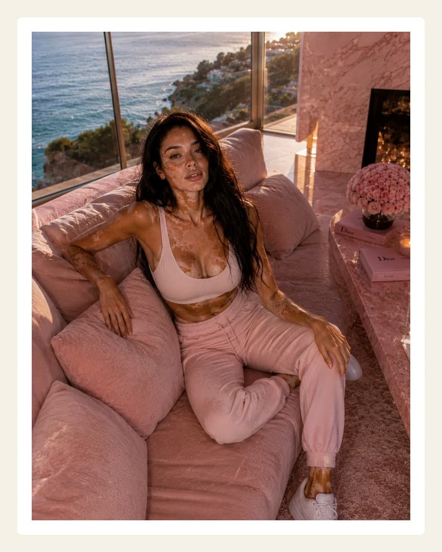 Curvy brunette in pink activewear