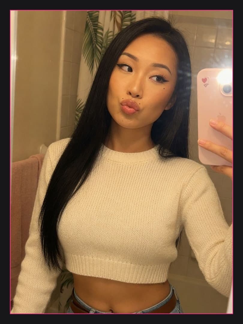 Bathroom mirror selfie in crop sweater