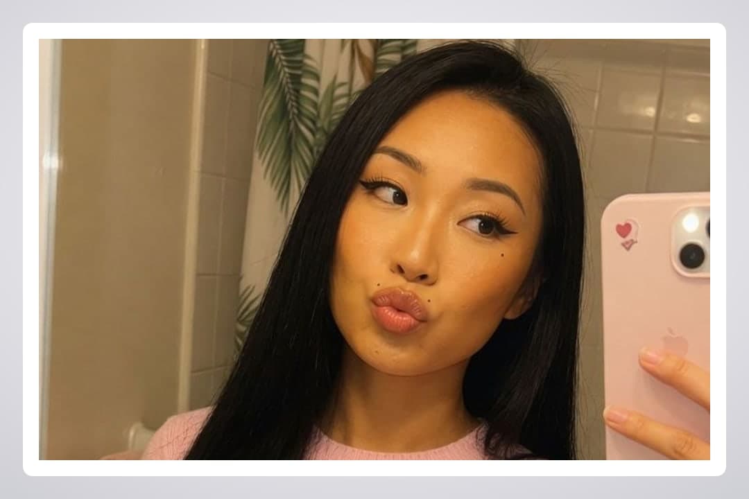 Young adult bathroom duck face selfie