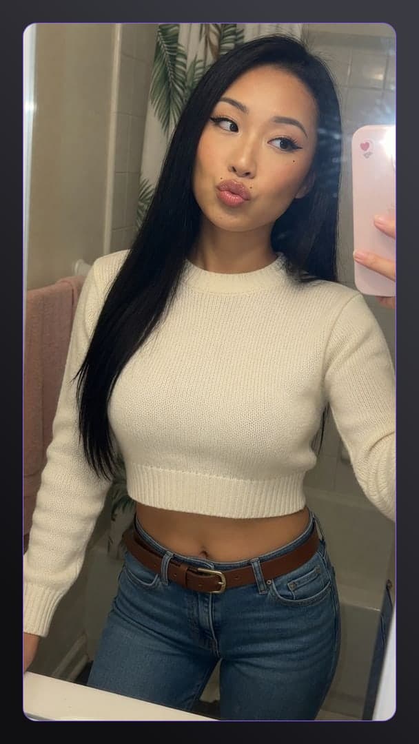 Bathroom mirror selfie in crop top