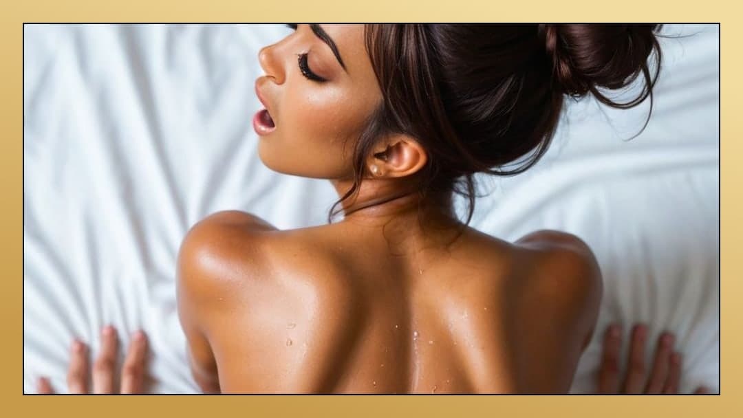 Brunette arched on sheets in pleasure