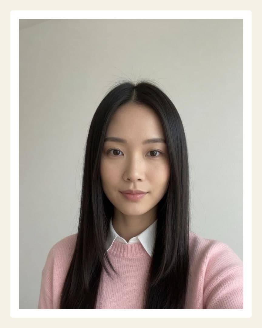 Raven hair close-up selfie in pink sweater