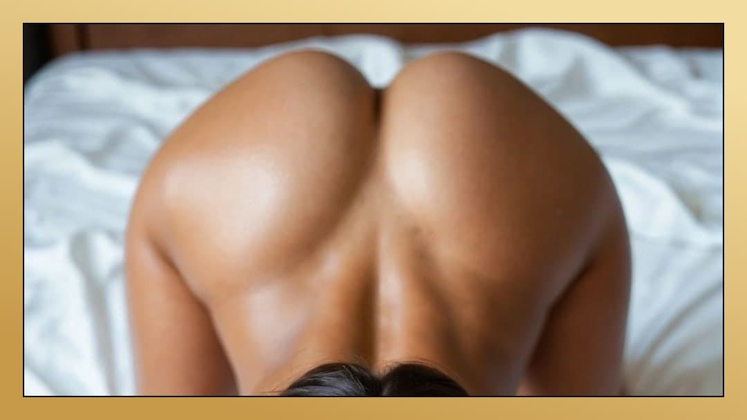 Ebony ass raised on white sheets