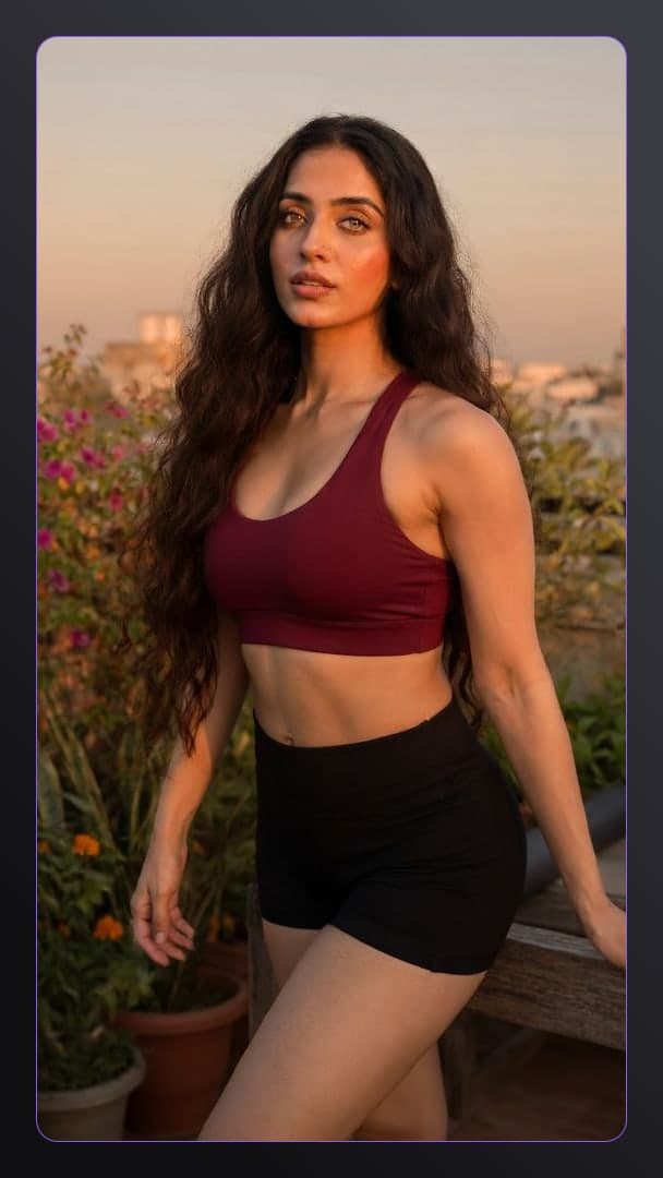 Rooftop sunset sports bra pose