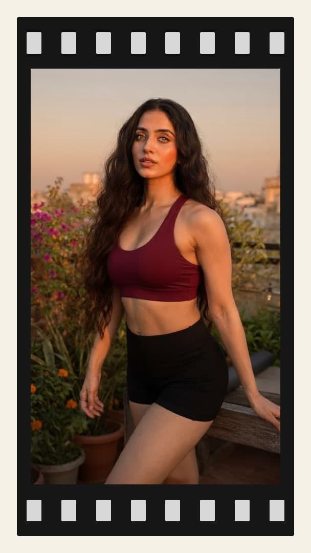 Rooftop sunset sports bra pose