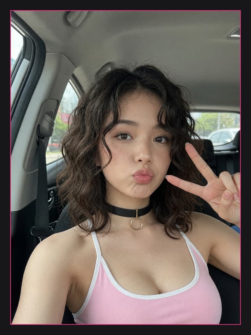 Peace sign car selfie pout