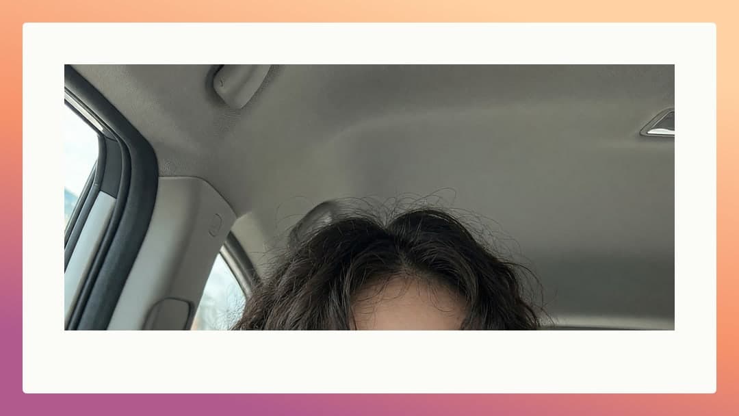 Brunette in car passenger seat