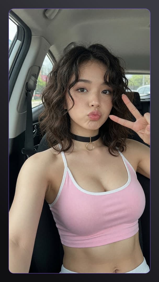 Pink crop top car selfie