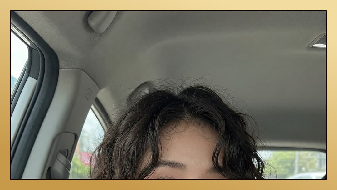 Young Asian selfie in car