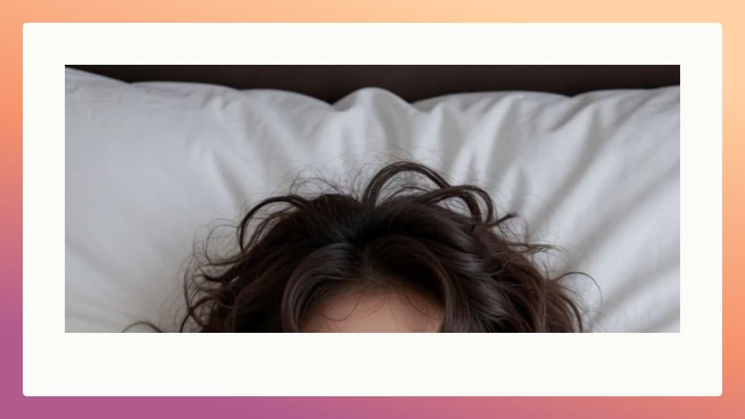 Brunette hair spread on pillow