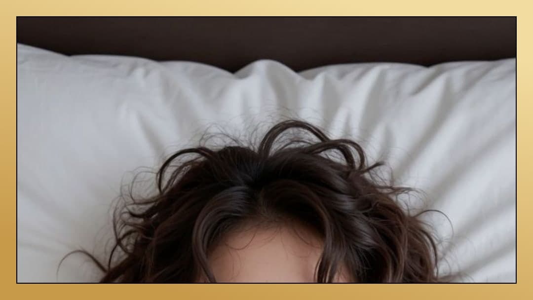 Brunette messy hair on white pillow
