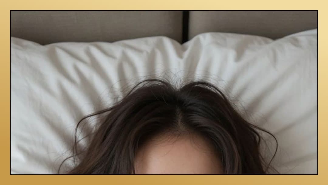 Young Asian in bed overhead