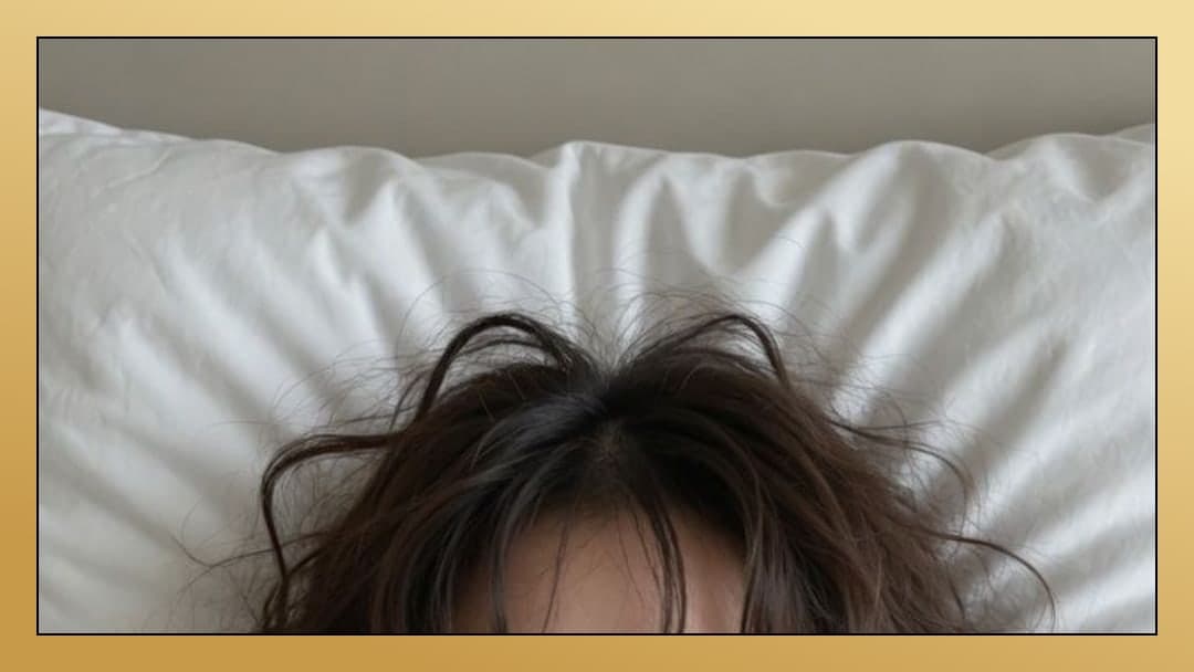Overhead view brunette hair on sheets