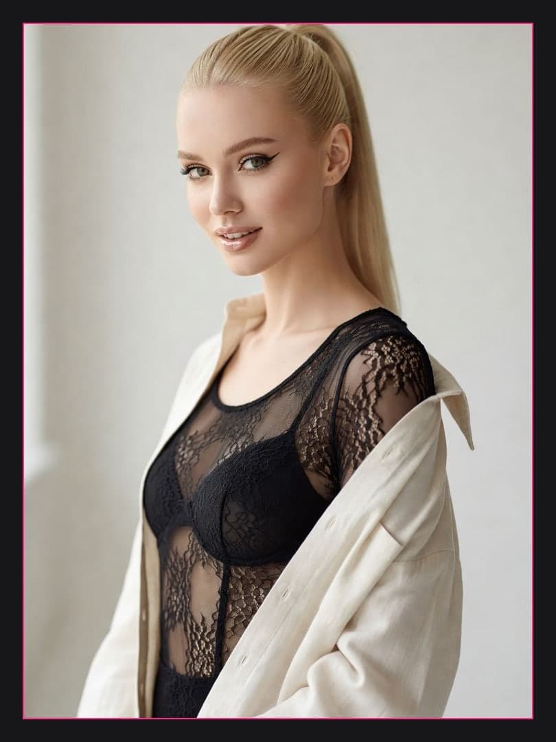 Sheer lace bodysuit in bright room