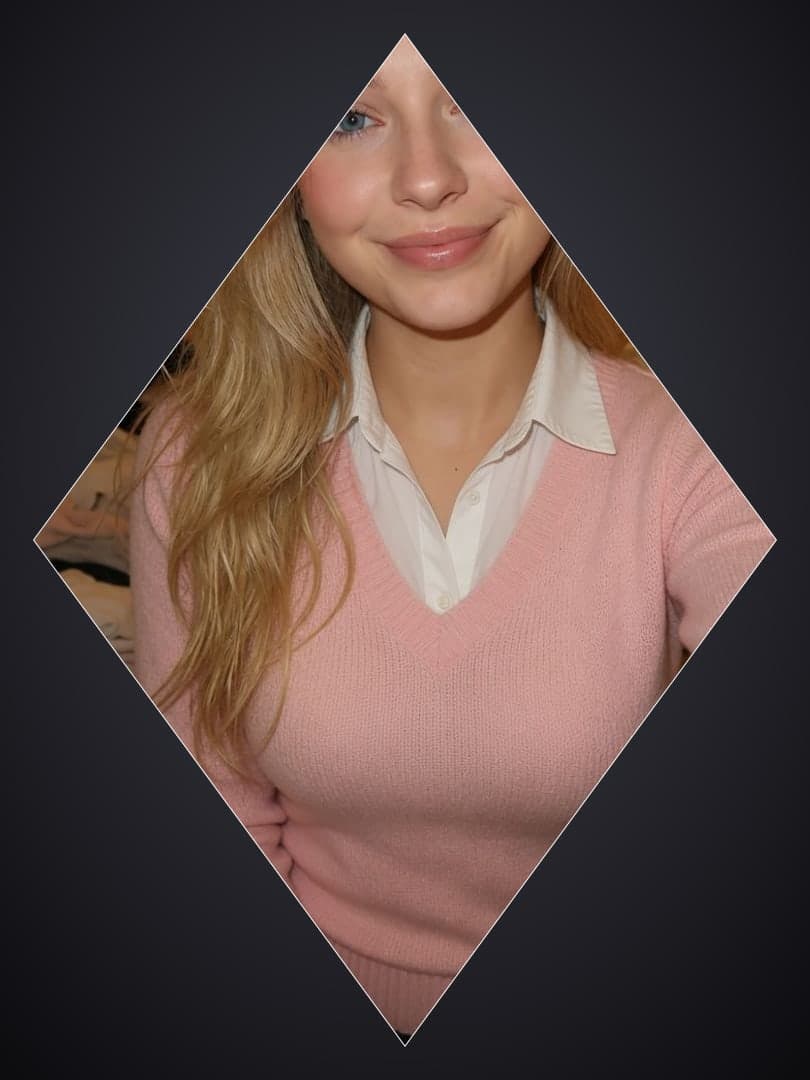 Pink sweater vest selfie close-up