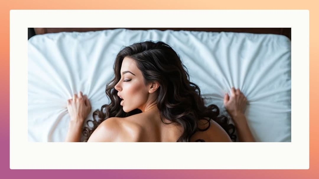 Face down on white sheets, gripping tight