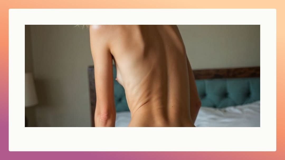 Young adult topless from behind