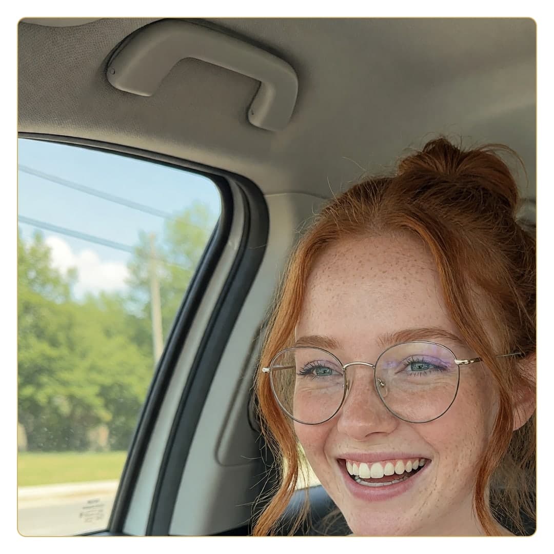 Redhead glasses car selfie