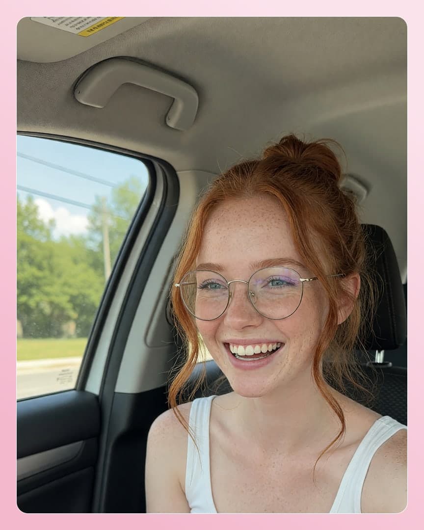 Redhead with glasses car selfie