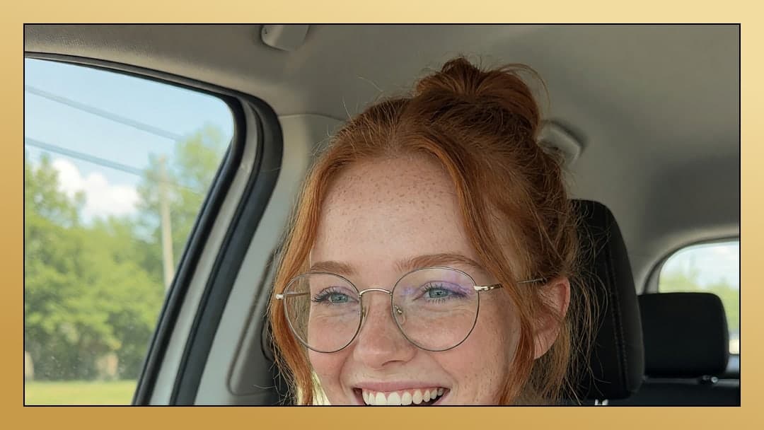 Redhead selfie in car passenger seat