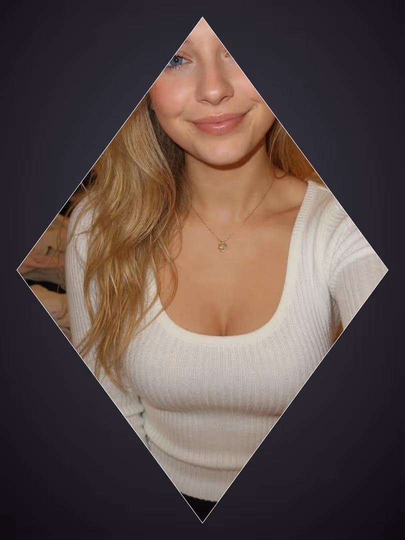 Blonde in white sweater selfie