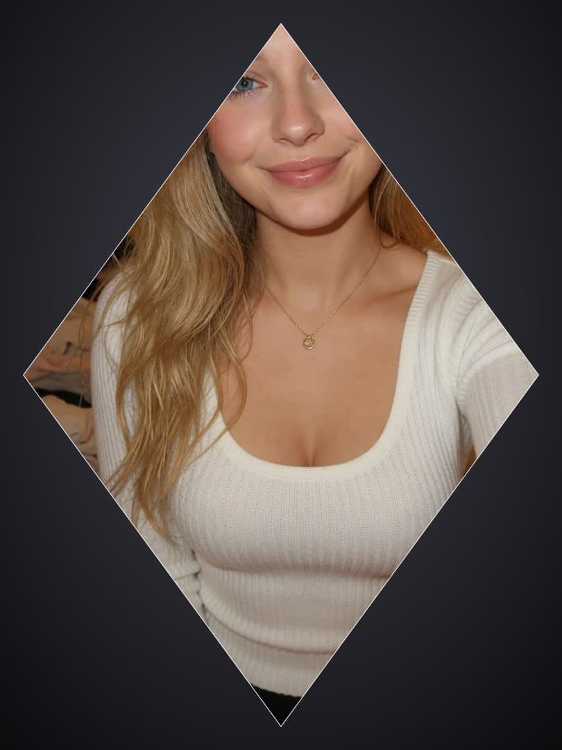 Blonde in white sweater selfie