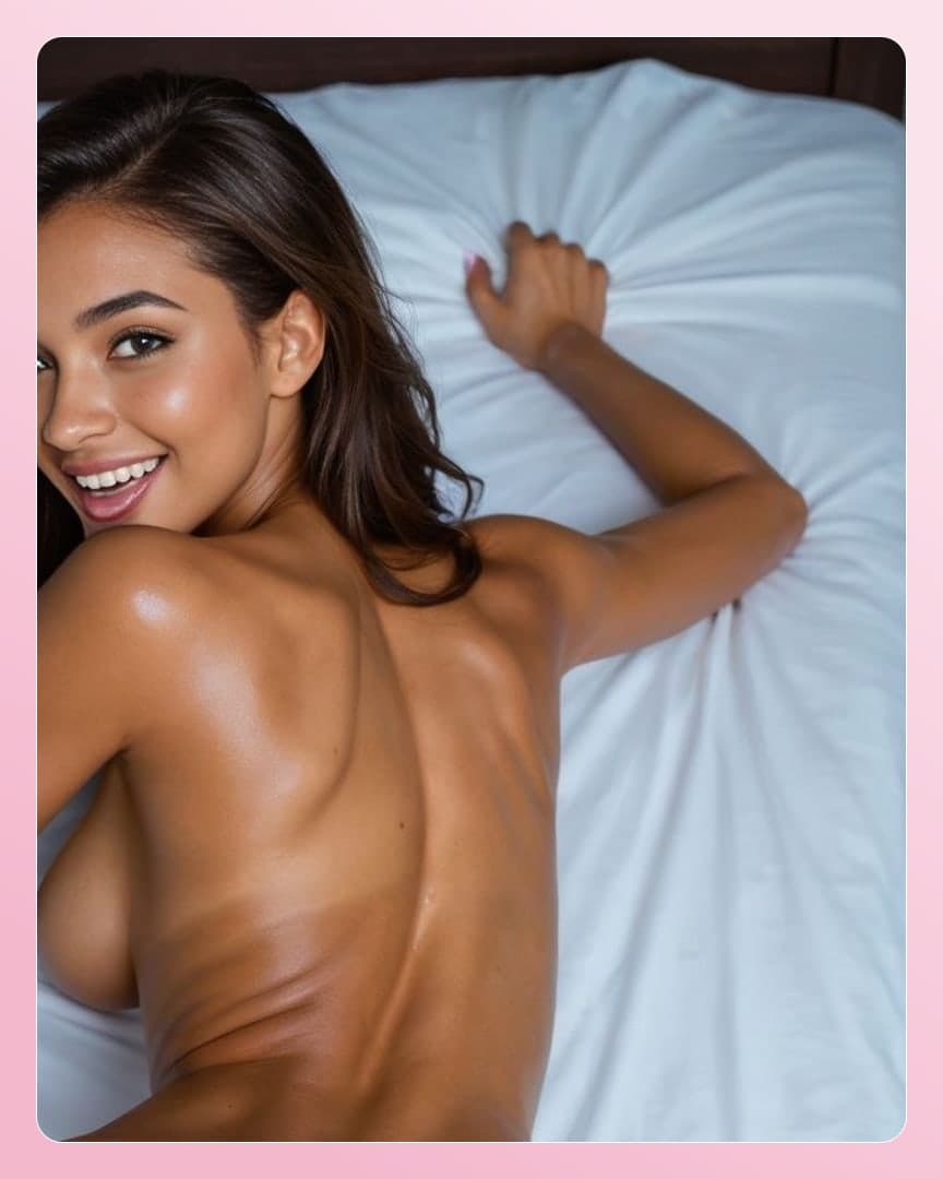 Topless Latina smile on white sheets