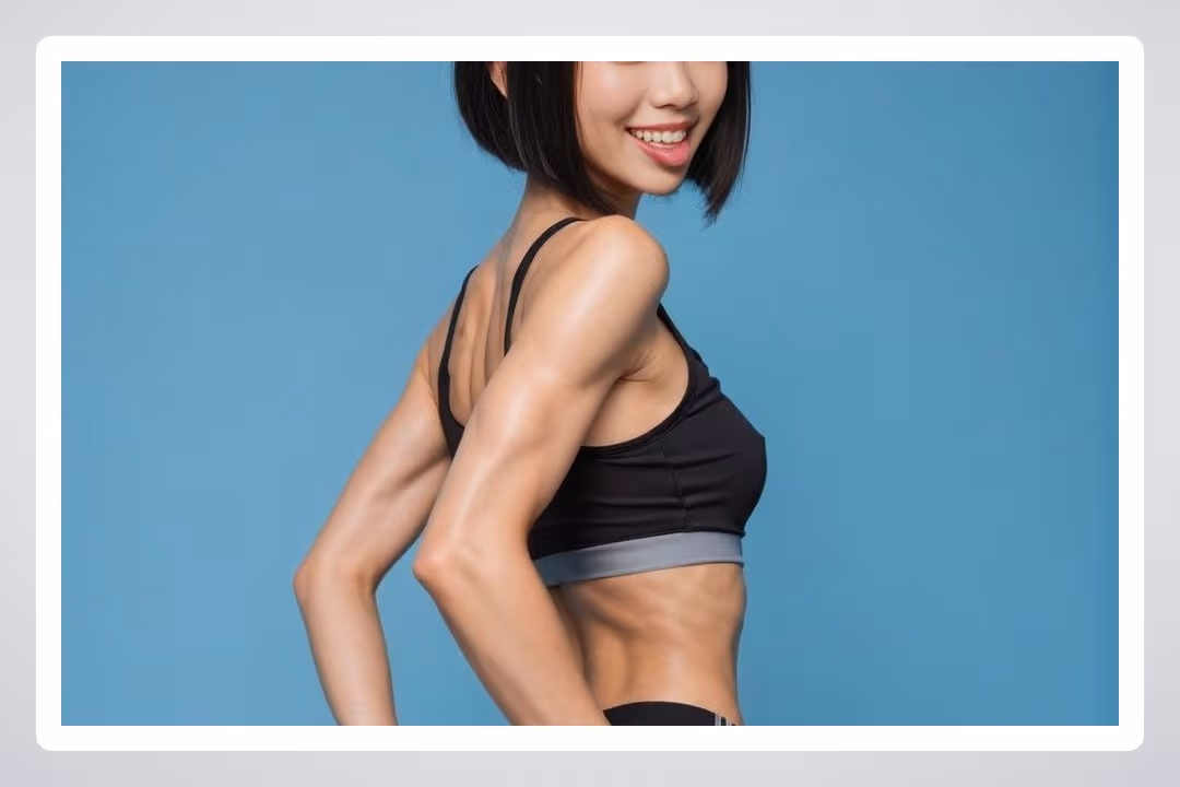 Young Asian in sports bra studio