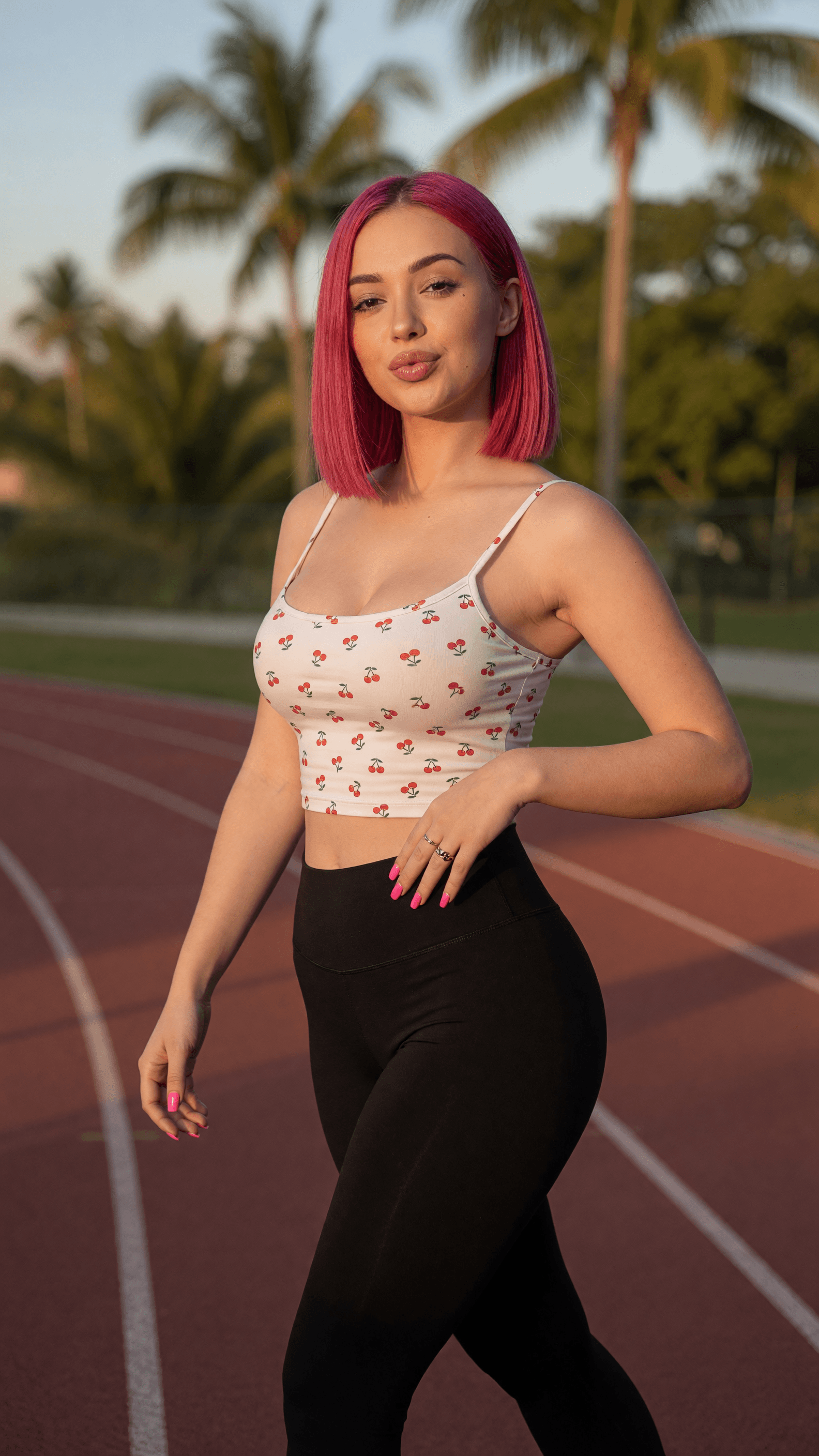Curvy pink bob on running track