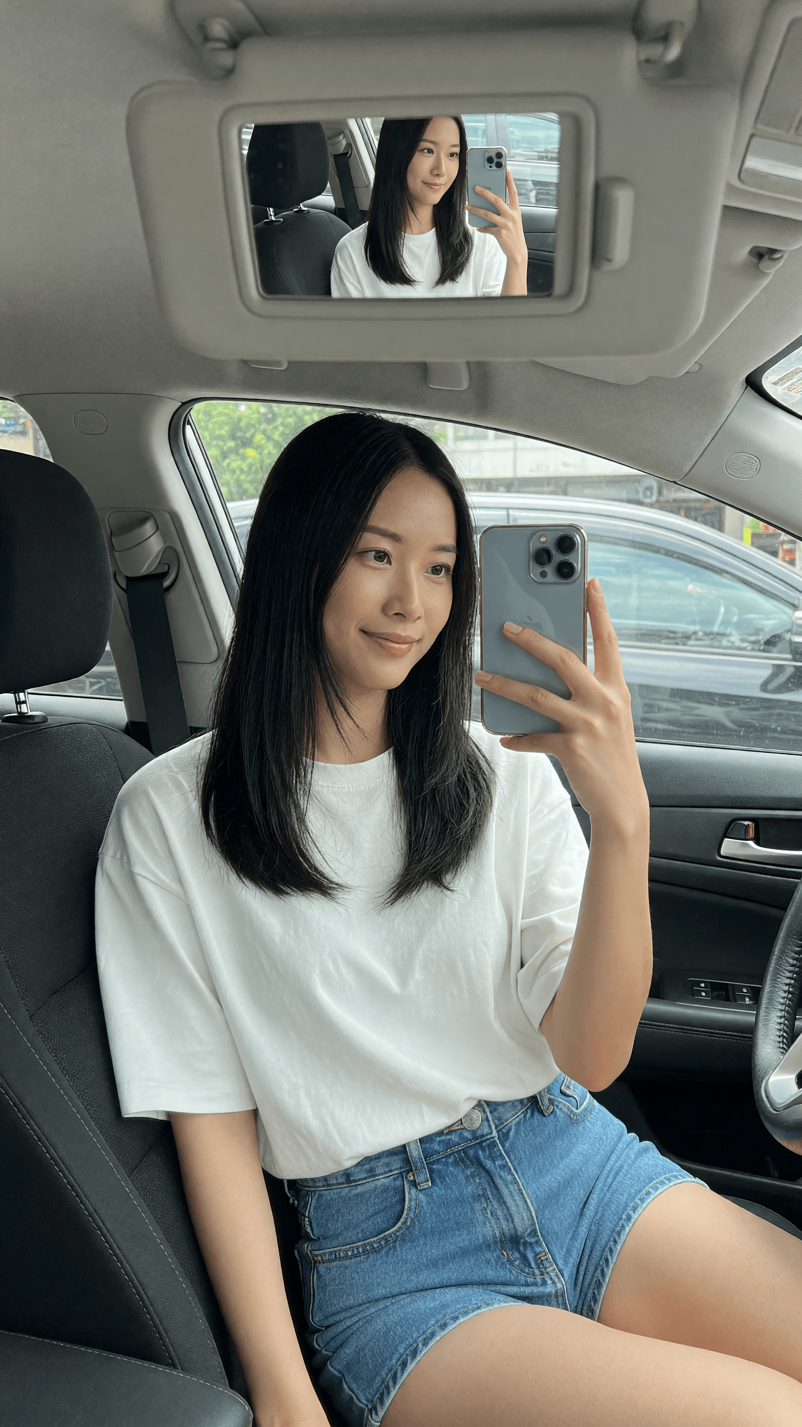 Raven hair brunette Asian selfie in car shorts