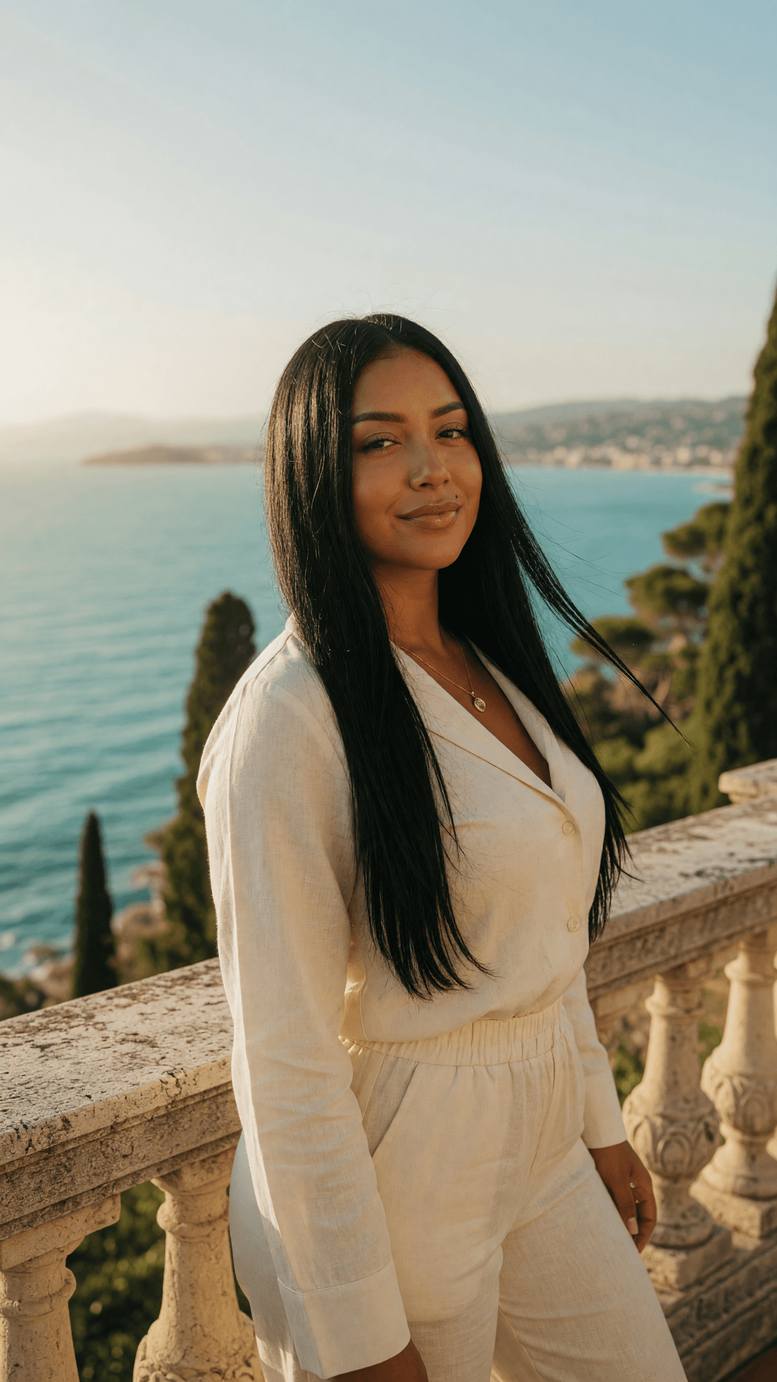Cream linen cleavage on cliff balcony
