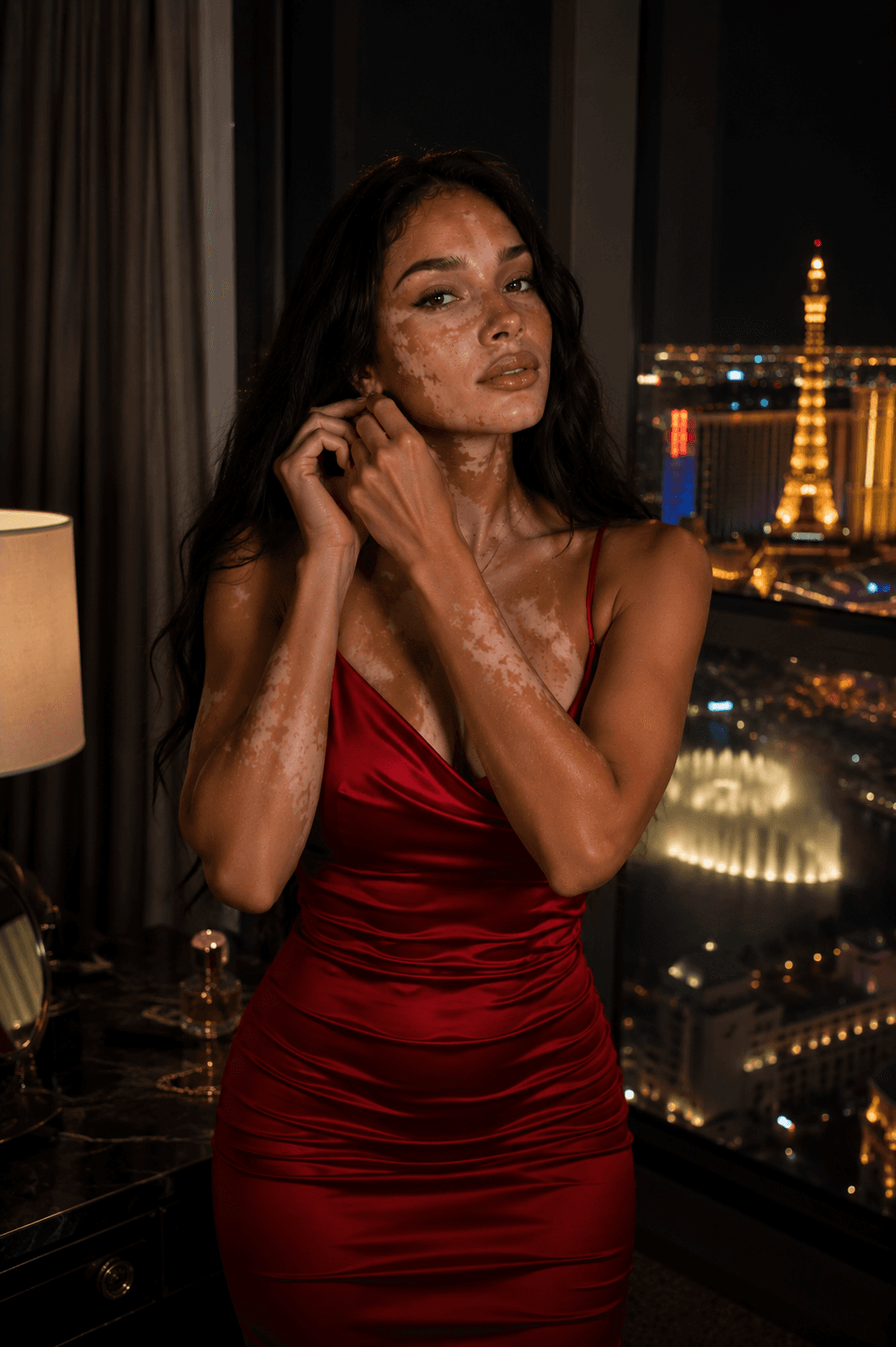 Slim brunette in red satin dress Vegas suite