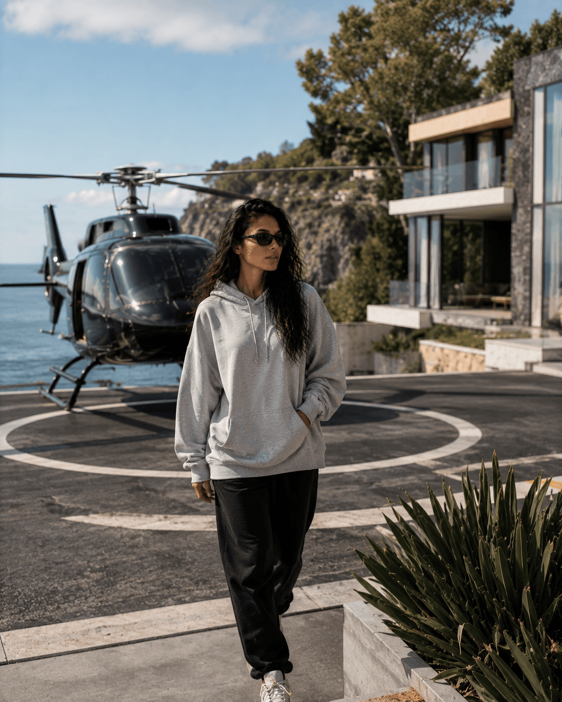 Rooftop helipad walk in oversized hoodie