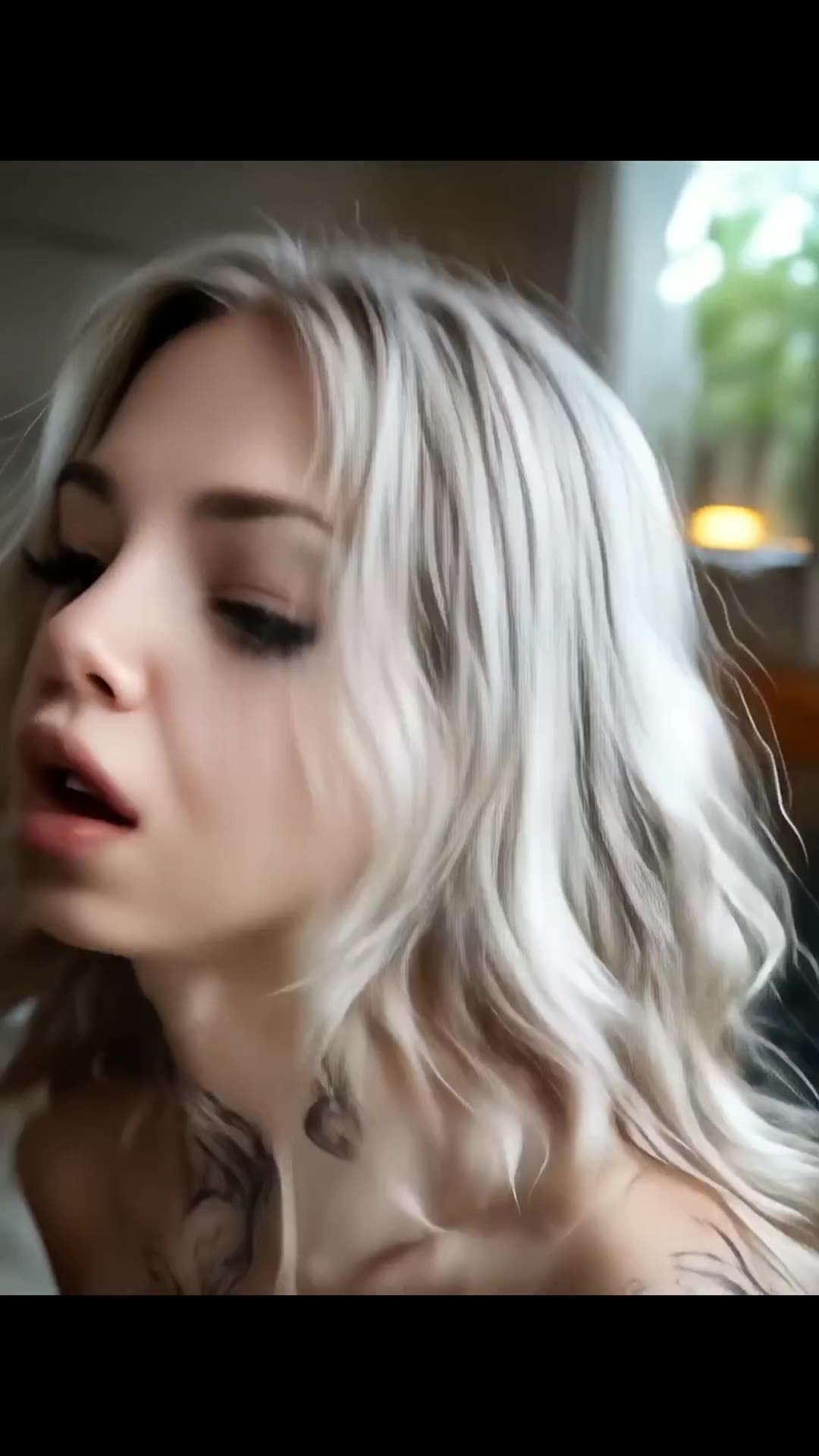 Topless platinum blonde in bedroom window light