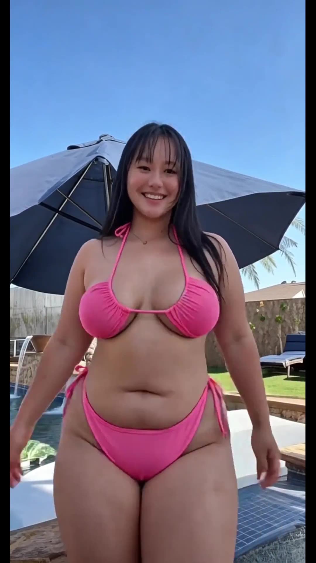 Long black hair green eyes curvy bikini poolside