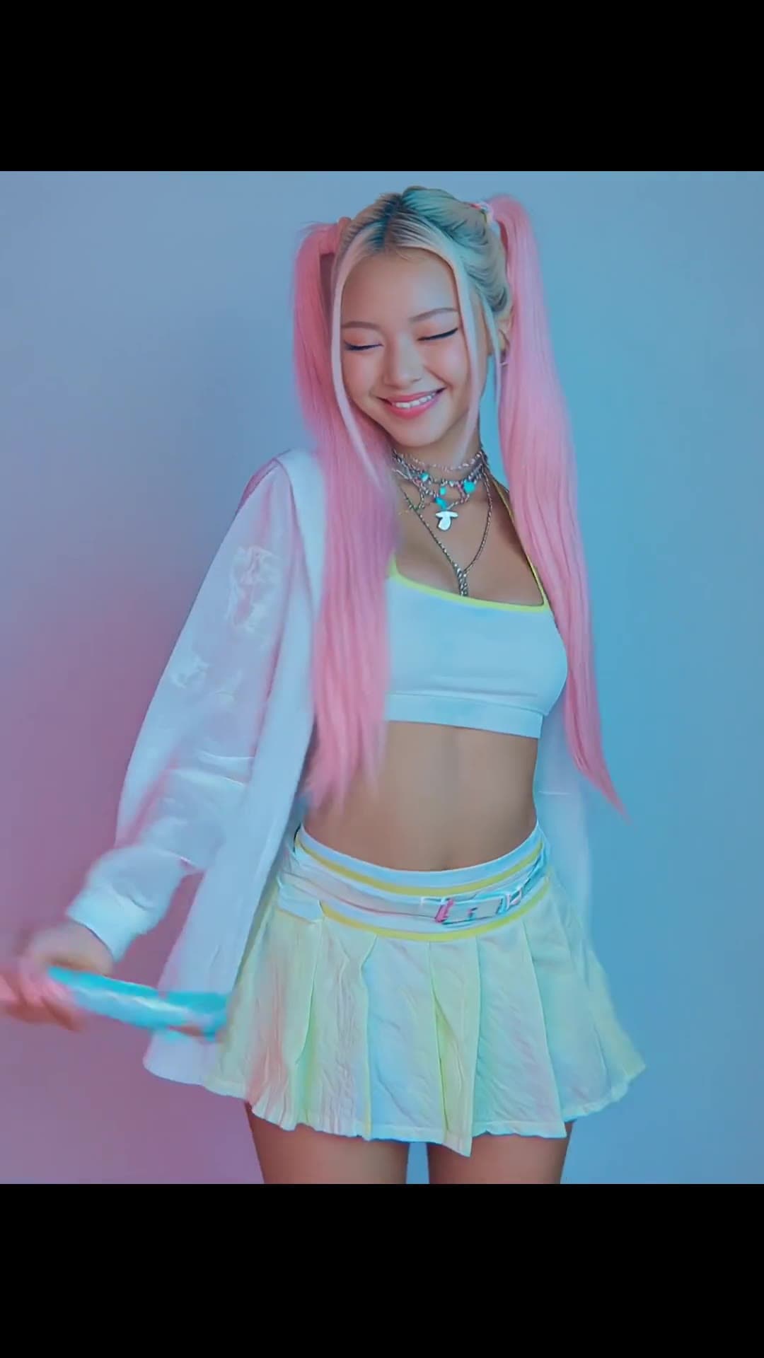 Blonde with pink pigtails in crop top studio tease